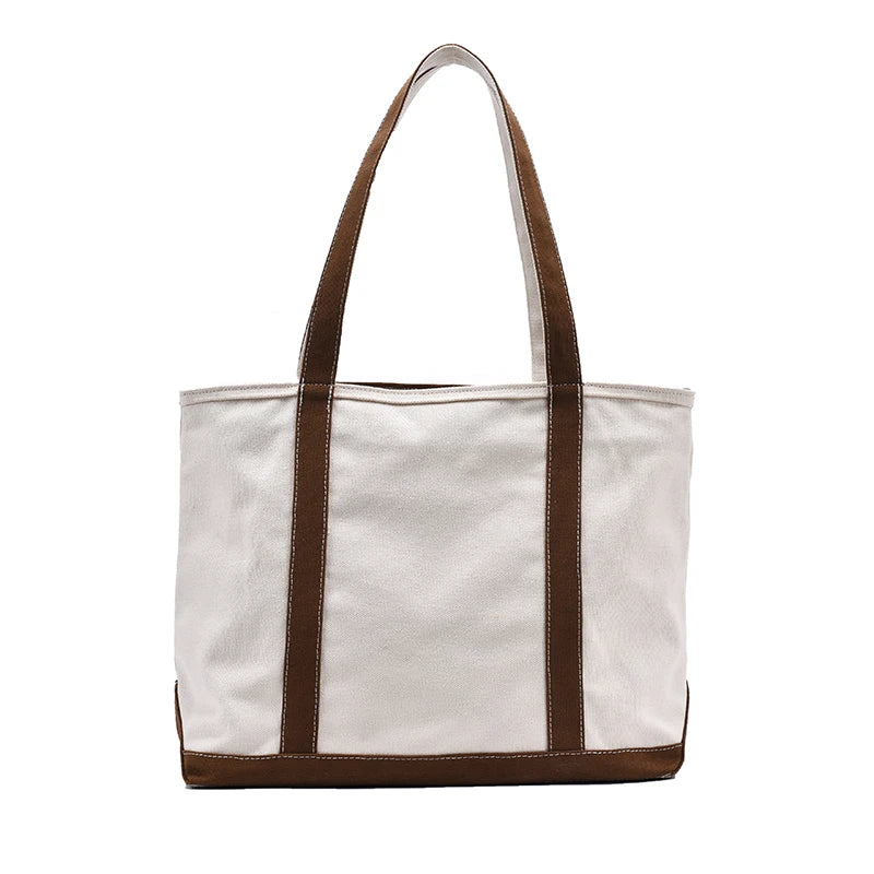 "Upgrade your casual accessory collection with our Women's Canvas Striped Handbag"