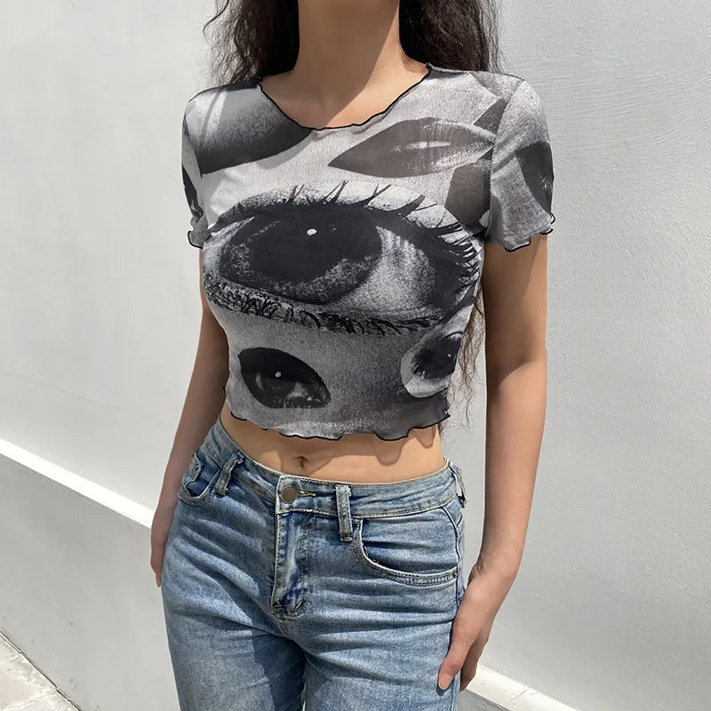 "Step back into the 90s with our Vintage Gothic Ogen Print Crop Top"