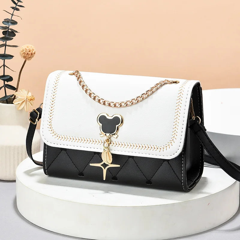 "Add a touch of magic to your accessories with the Disney Mickey Women's Crossbody Shoulder Bag"