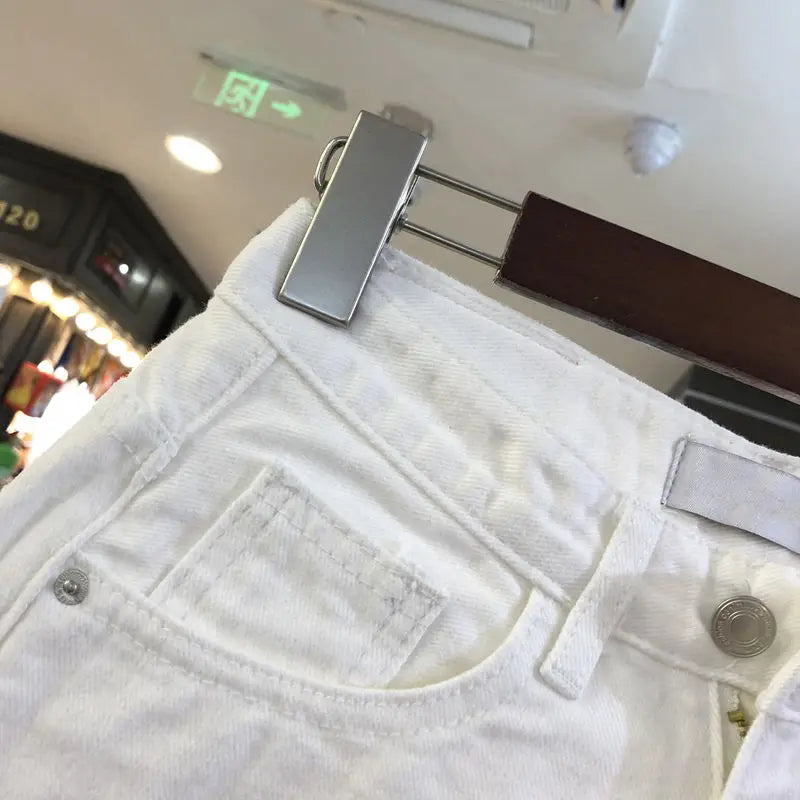 "Women's High-Waist Irregular White Denim Shorts for Spring and Summer"