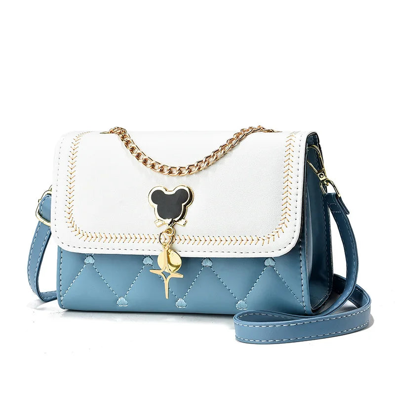 "Add a touch of magic to your accessories with the Disney Mickey Women's Crossbody Shoulder Bag"