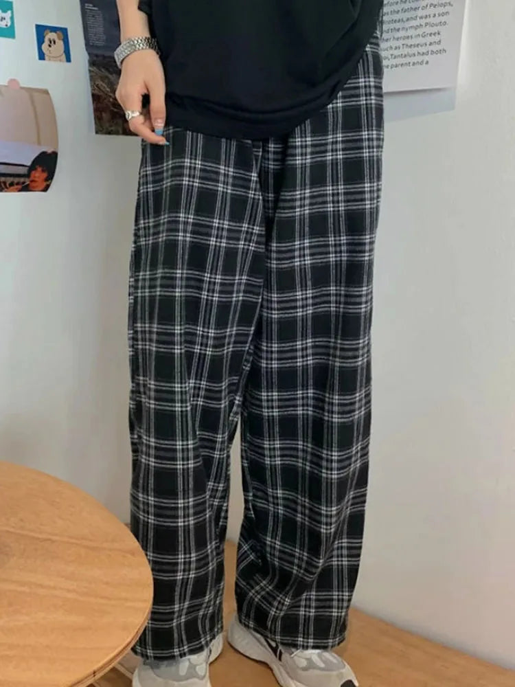 "Introducing our Women JMPRS Black Plaid Pants"