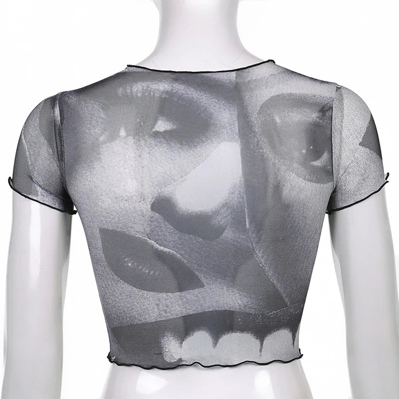 "Step back into the 90s with our Vintage Gothic Ogen Print Crop Top"