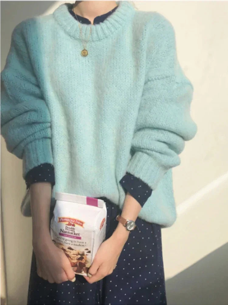 "Stay cozy and stylish this winter with our Women's Oversized Pink Pullover Sweater"