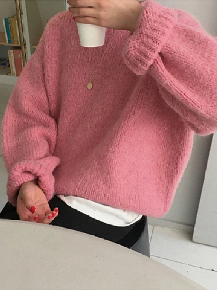 "Stay cozy and stylish this winter with our Women's Oversized Pink Pullover Sweater"