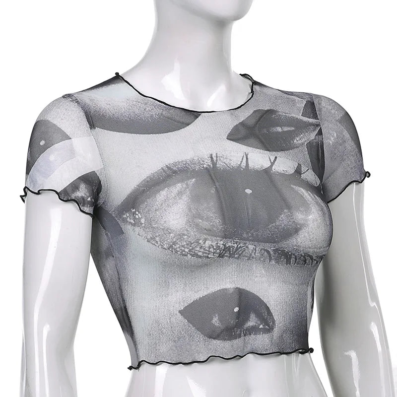 "Step back into the 90s with our Vintage Gothic Ogen Print Crop Top"