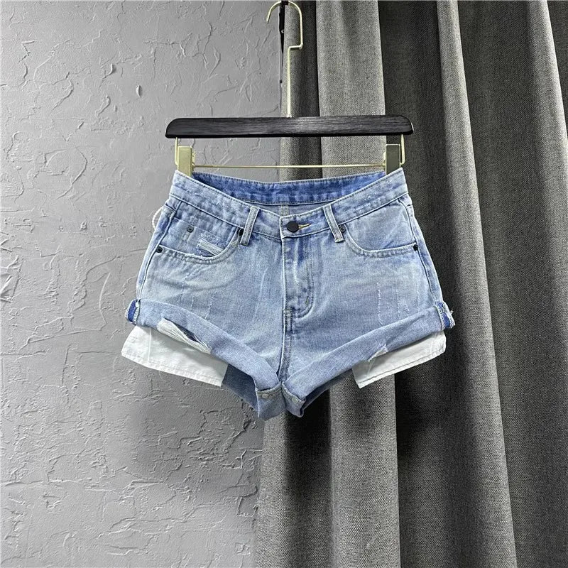 "Step into summer with style in our Women's Light Blue Low-Waisted Denim Shorts"