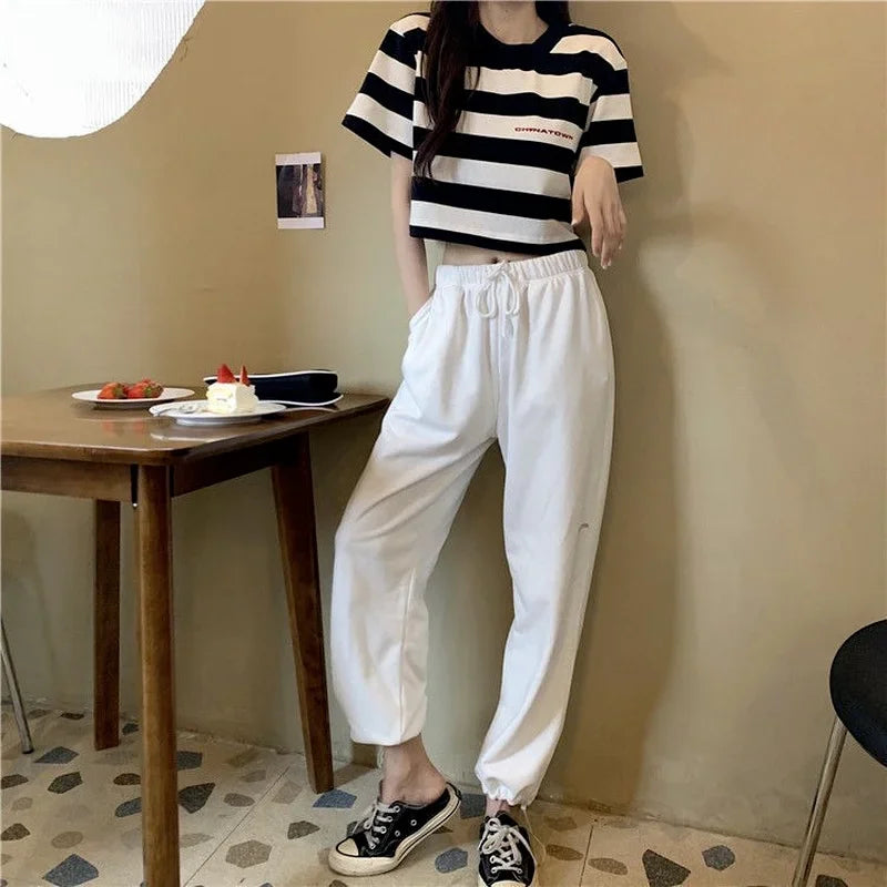 "Elevate your summer style with our Women's Black and White Striped Cropped Top"