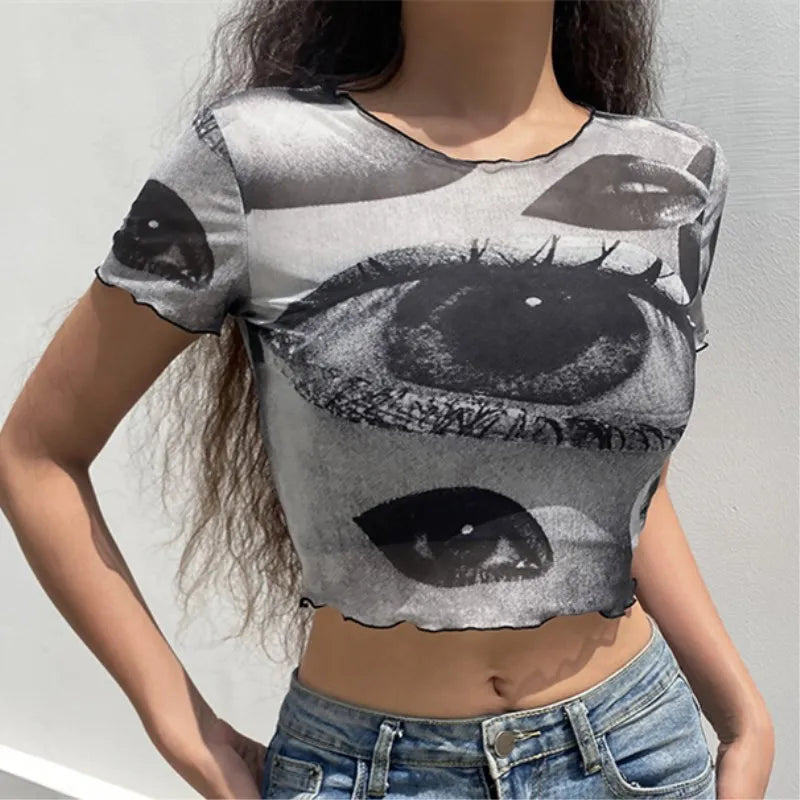 "Step back into the 90s with our Vintage Gothic Ogen Print Crop Top"