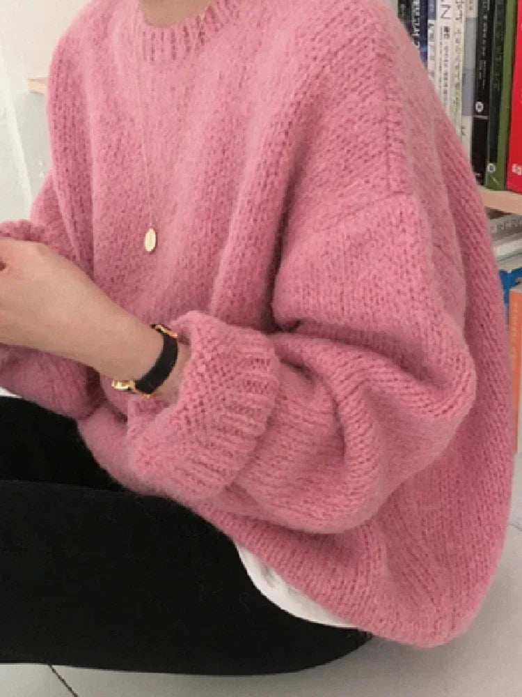 "Stay cozy and stylish this winter with our Women's Oversized Pink Pullover Sweater"