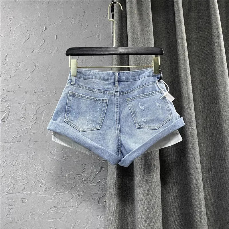 "Step into summer with style in our Women's Light Blue Low-Waisted Denim Shorts"