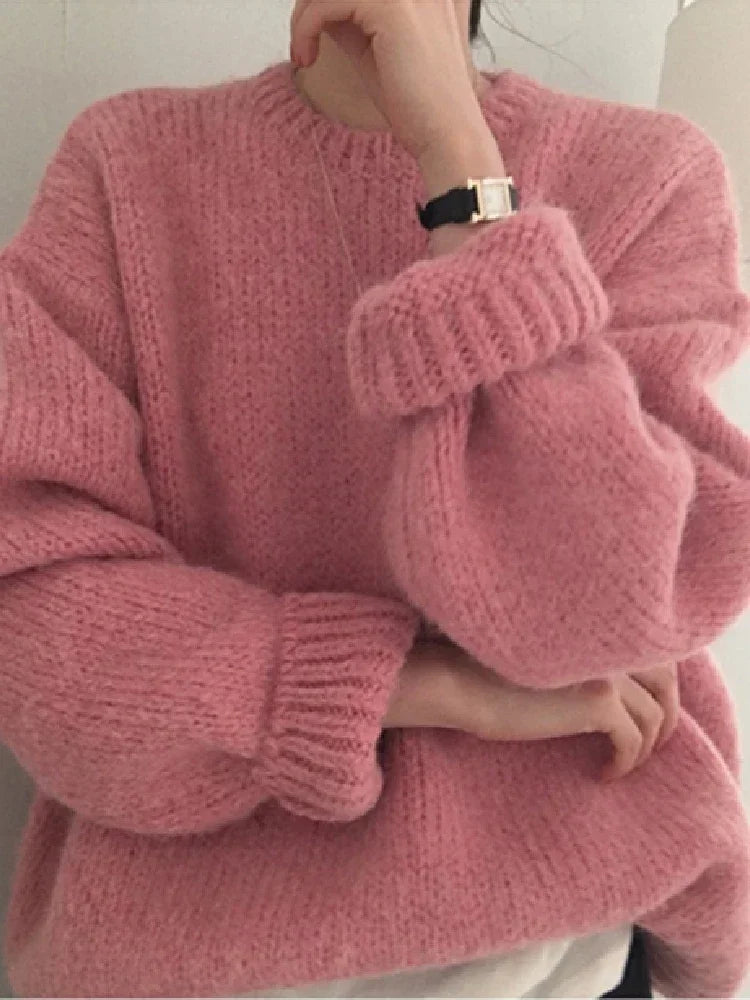 "Stay cozy and stylish this winter with our Women's Oversized Pink Pullover Sweater"