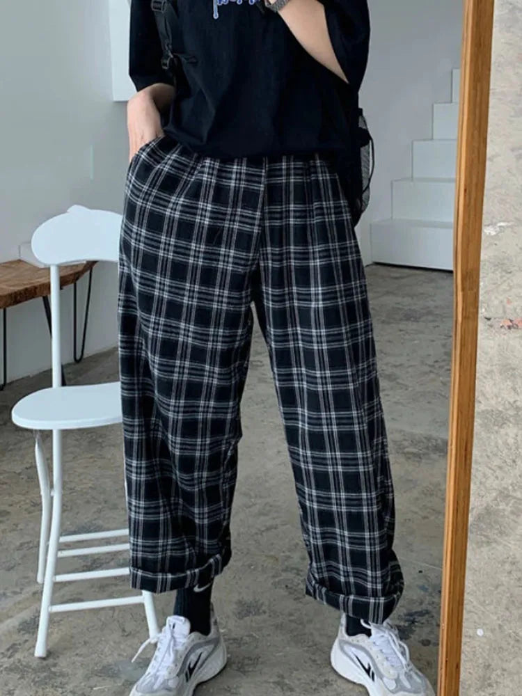 "Introducing our Women JMPRS Black Plaid Pants"